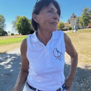 polo de golf sans manches femme "Les Cigognes au Golf" avec logo devant et dans le dos